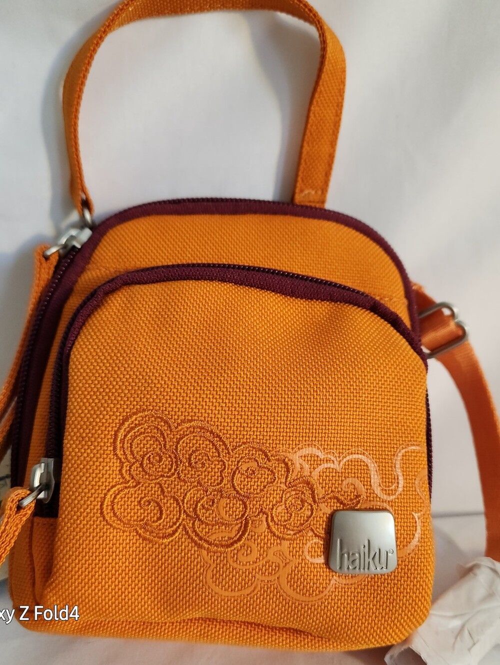 Haiku Orange Crossbody with Plum Trim and Embroidered Swirls
